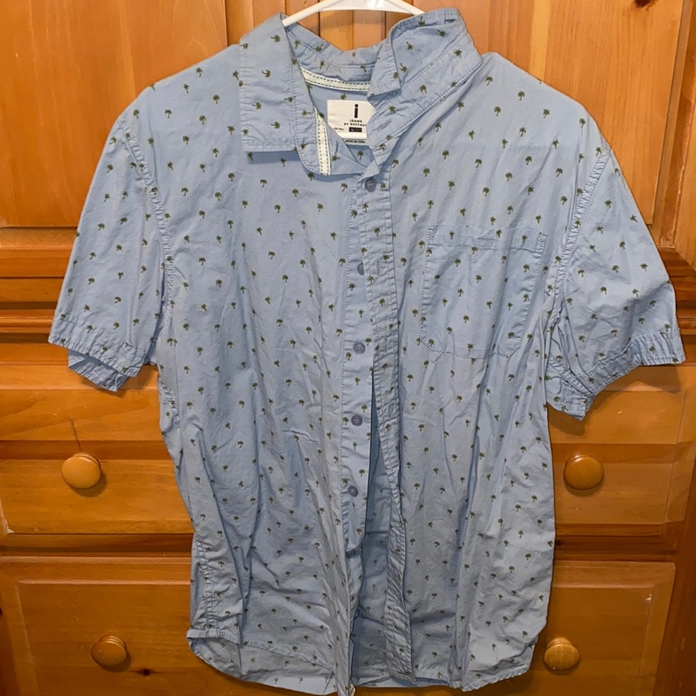 Light blue button up with palm tree designs.